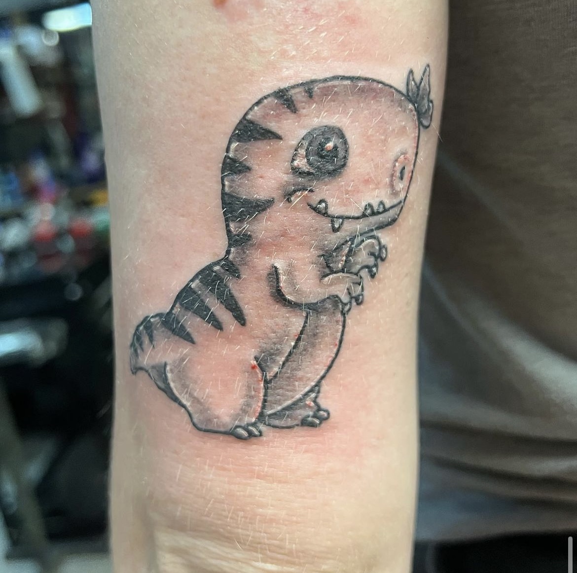 Fine-line tattoo work by Justin